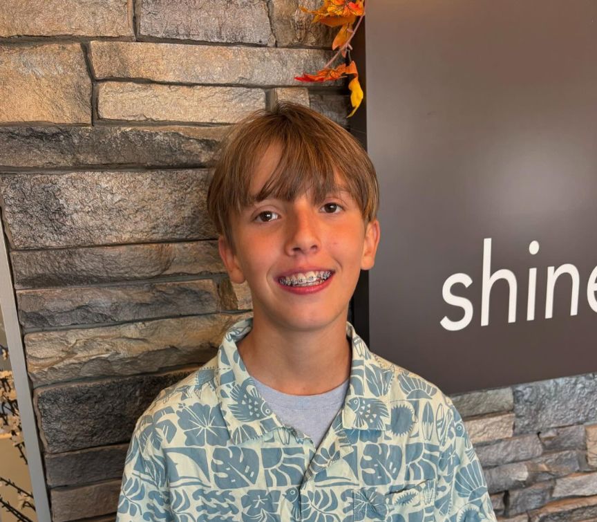 Boy smiling after receiving braces  
